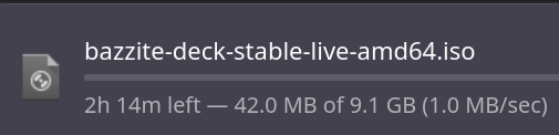 a screenshot of a firefox download for bazzite-deck-stable-live-amd64.iso. It says: "2h 14m left - 42.0 MB of 9.1GB (1.0 MB/sec))"